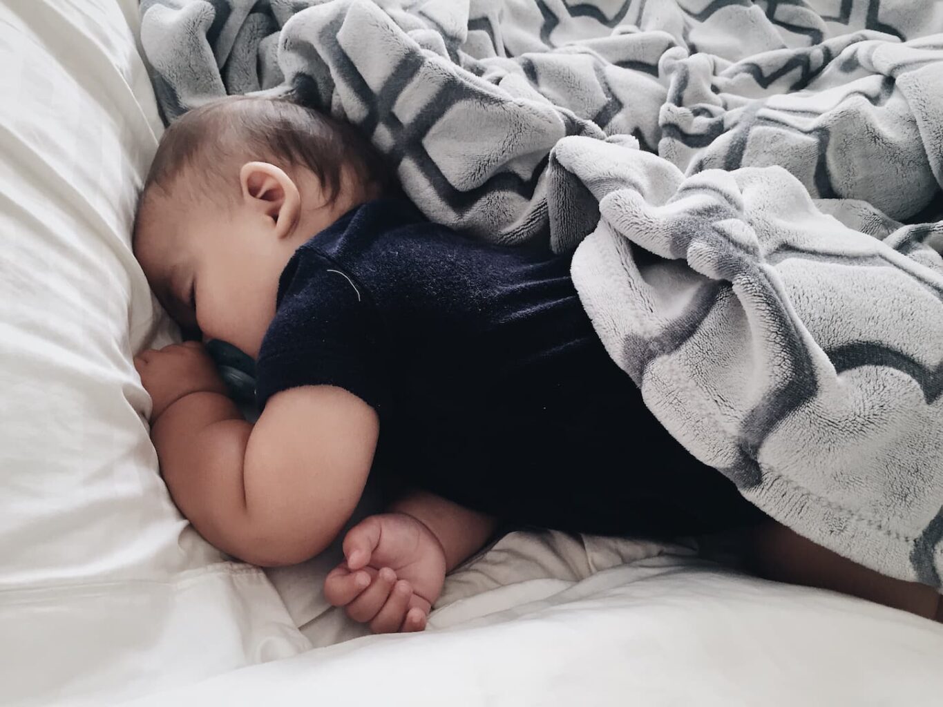 An image of a baby sleeping.